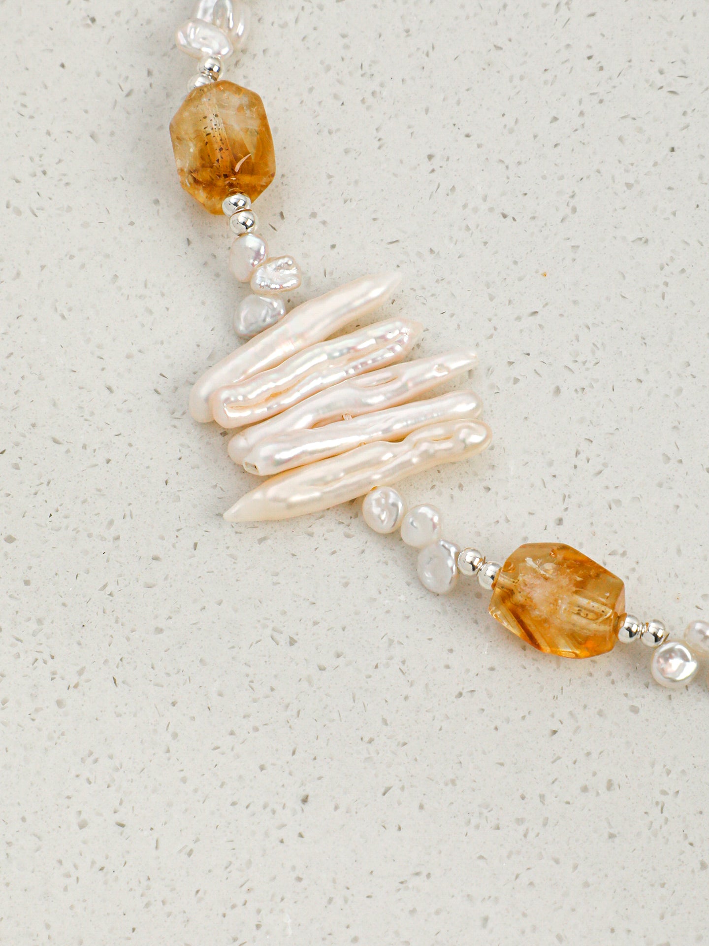Macro close-up of Natural Brazilian Citrine and Sculptural Tooth Baroque Pearl Necklace,natural gemstone and pearl texture,925 sterling silver fine jewelry