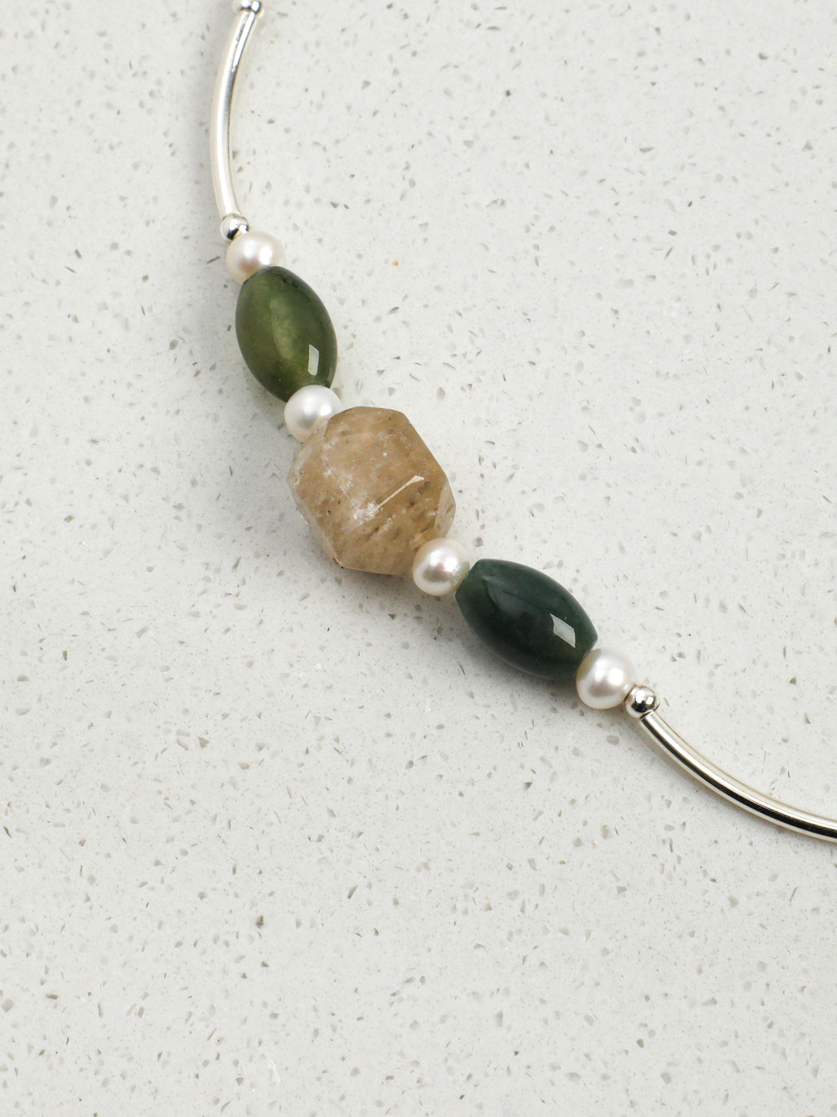 Macro close-up of Natural Phantom Quartz and Moss Agate Statement Necklace,natural gemstone and pearl texture,925 sterling silver fine jewelry