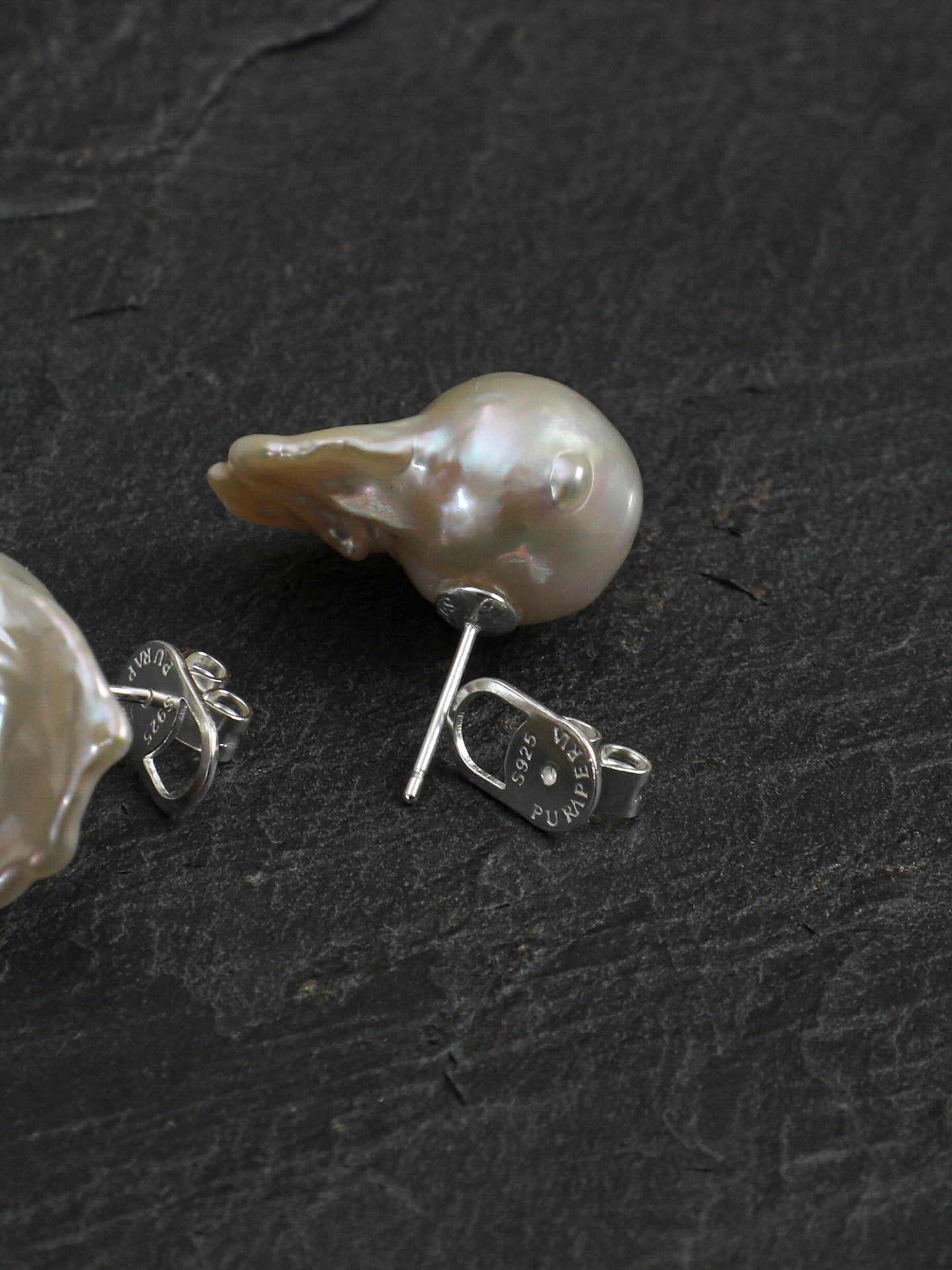 Close-up detail shot of Statement Fishtail Large Baroque Pearl Stud Earrings,handcrafted crystal pearl jewelry,925 sterling silver,minimalist luxury gift for women