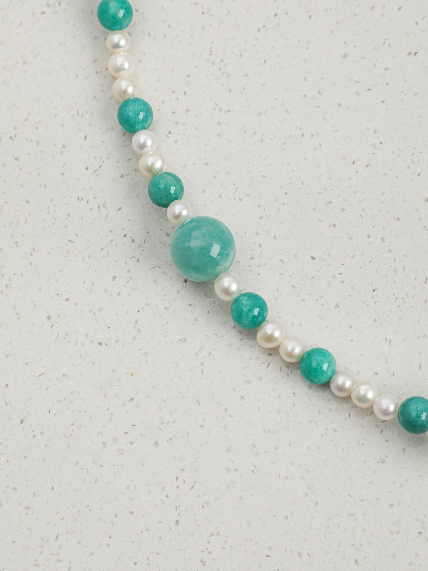 Macro close-up of Natural Amazonite and Clear Quartz Beaded Necklace,handcrafted crystal pearl jewelry,925 sterling silver,minimalist luxury gift for women