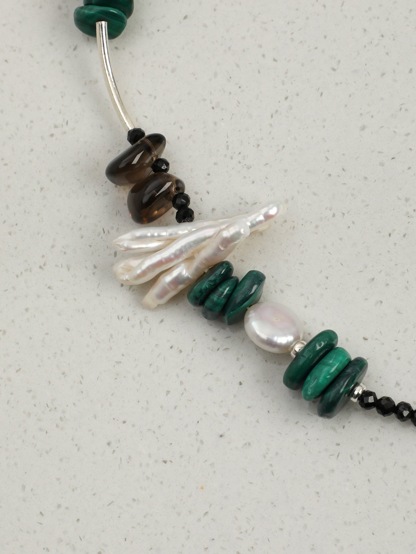 Macro close-up detail shot of Natural Malachite and Smoky Quartz Statement Necklace,natural gemstone and pearl texture,925 sterling silver fine jewelry