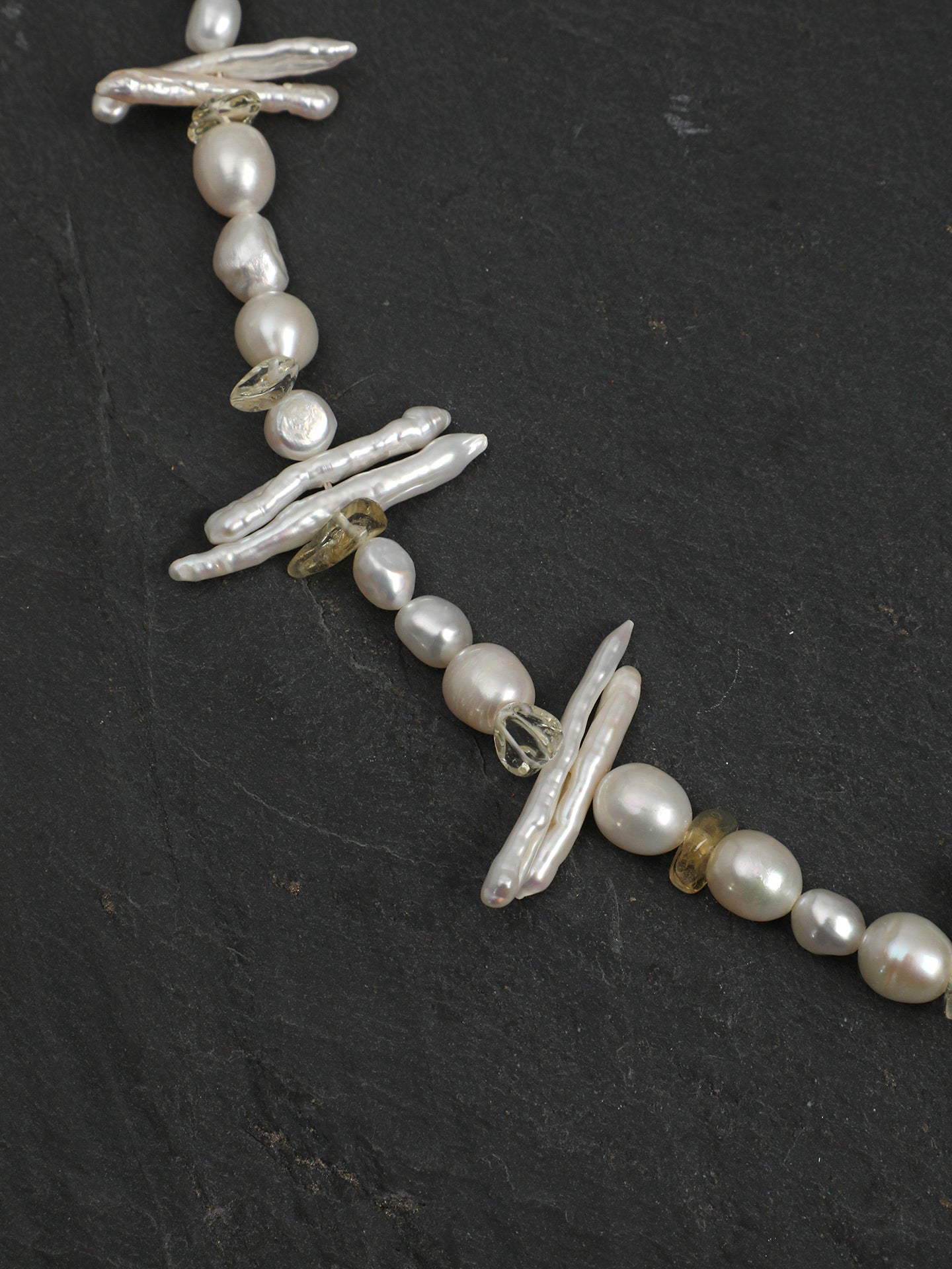 Macro close-up of Natural Citrine and Sculptural Baroque Pearl Statement Necklace,natural gemstone and pearl texture,925 sterling silver fine jewelry