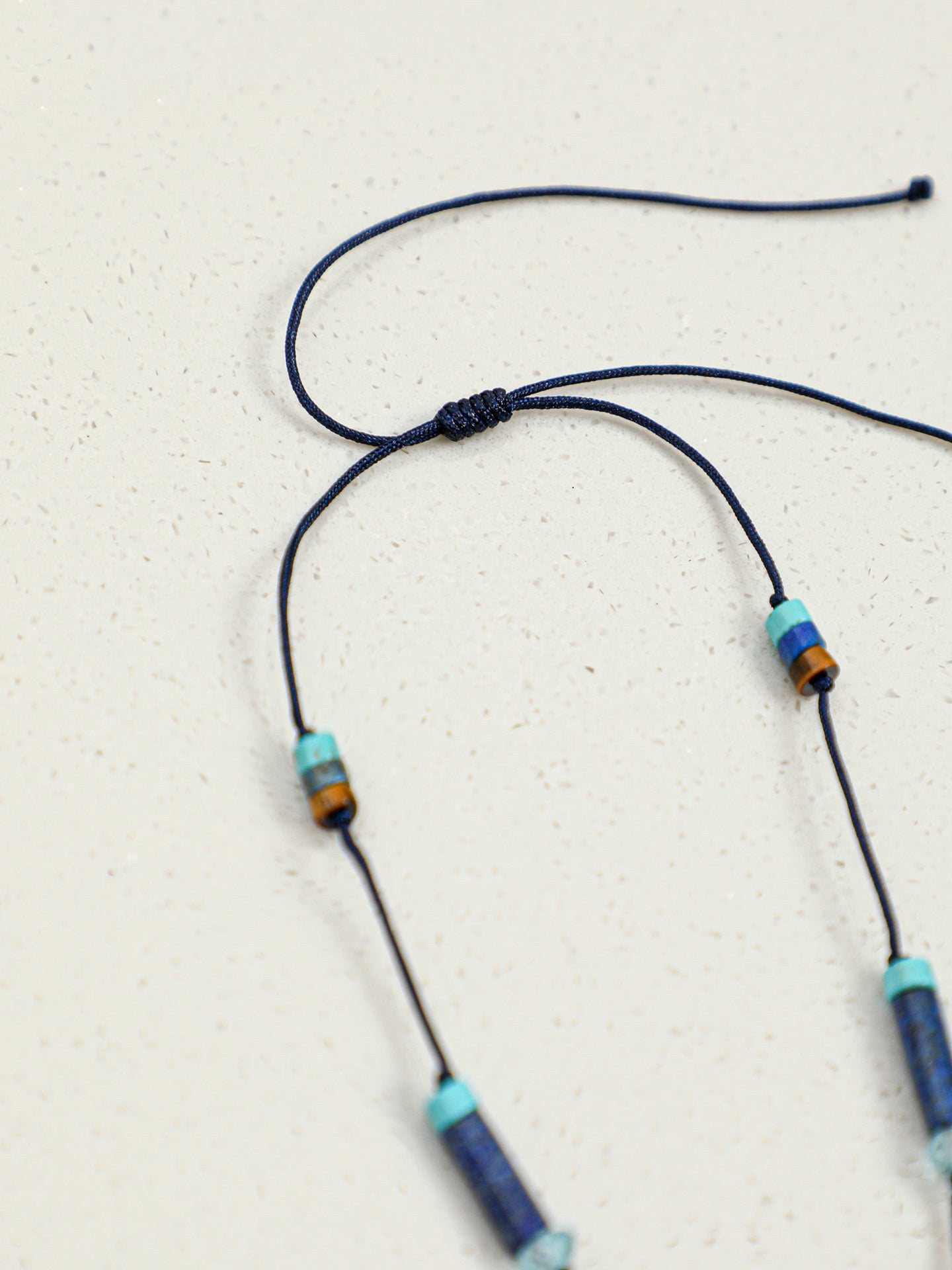 Macro close-up of Natural Lapis Lazuli,Turquoise,and Pearl Tassel Long Necklace,handcrafted crystal pearl jewelry,925 sterling silver,minimalist luxury gift for women,long sweater chain