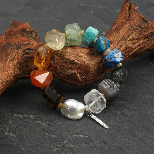 Chunky rainbow natural gemstone and oversized baroque pearl bracelet with S925 silver tag on neutral background