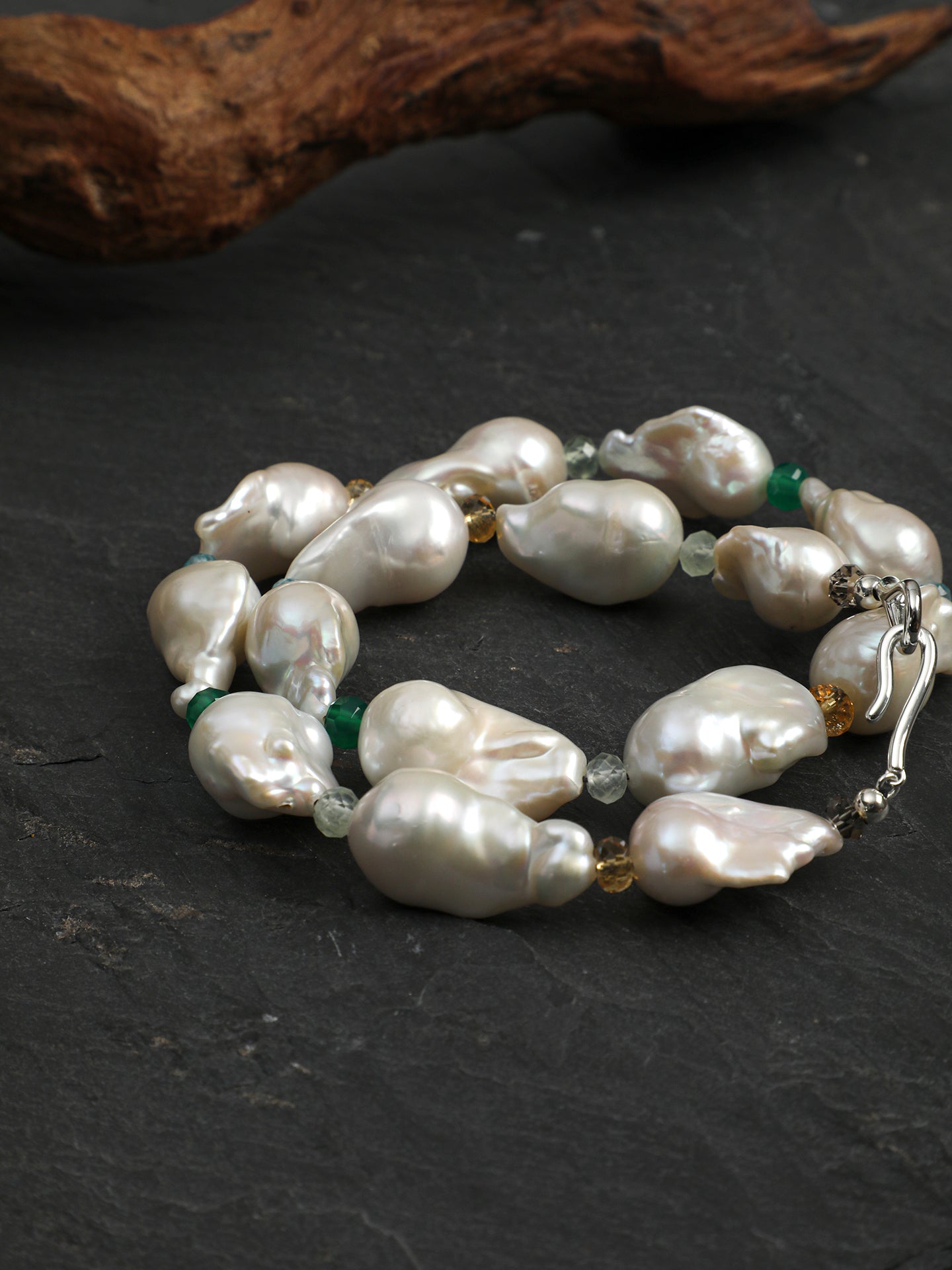 Close-up detail shot of Statement Baroque Pearl and Multi-Gemstone Choker Necklace,natural gemstone and pearl texture,925 sterling silver fine jewelry