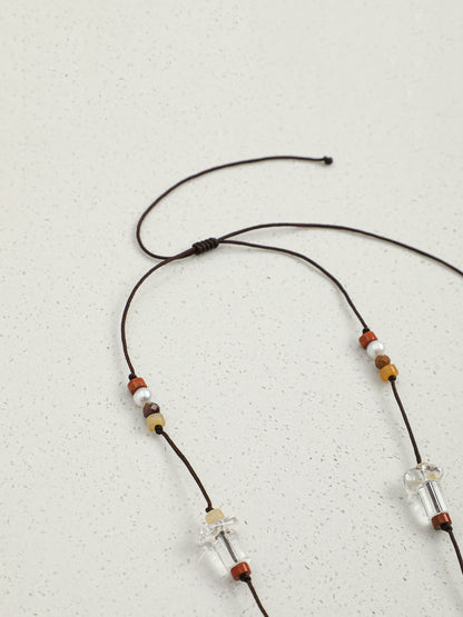 Macro close-up of  Natural Clear Quartz Gourd and Multi-Gemstone Long Necklace,handcrafted crystal pearl jewelry,925 sterling silver,minimalist luxury gift for women, long sweater chain