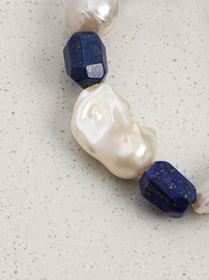 Macro close-up of lustrous irregular chunky baroque pearls showing organic surface texture