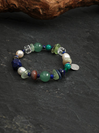Detailed view of textured Thai silver saucer spacer beads and customizable S925 round silver tag